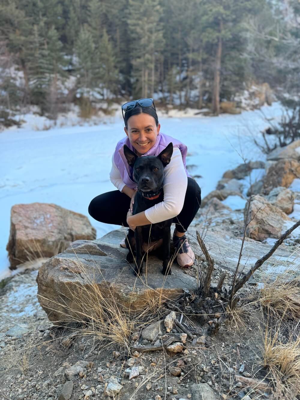 Dog trainer with dog during outdoor hike