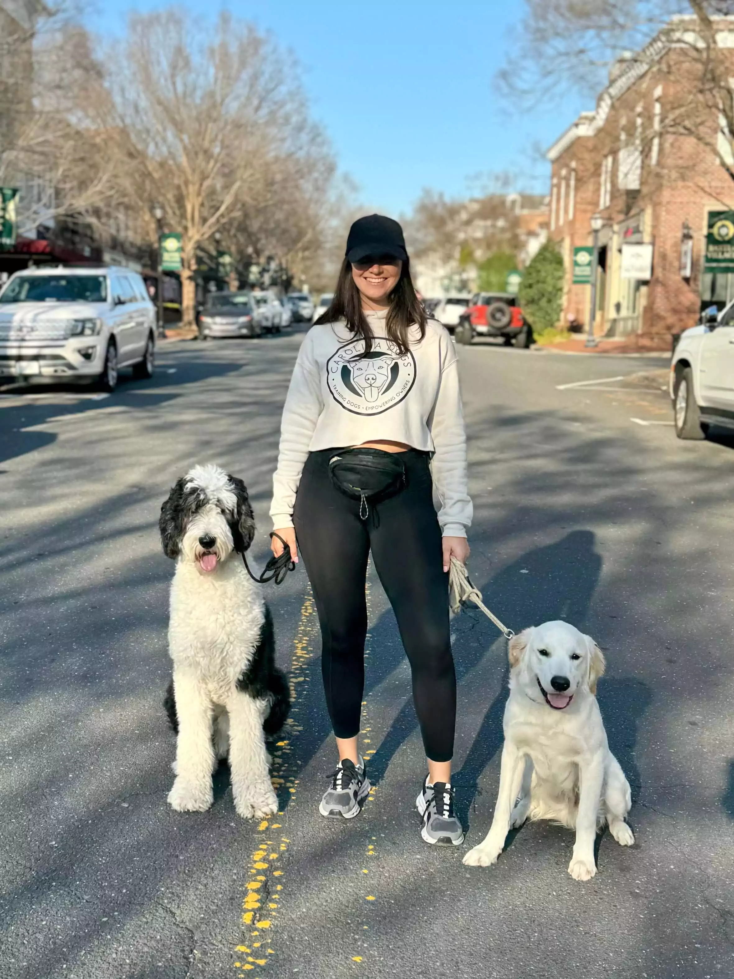 Nicole walking a dog during a training session for Carolina Dogs